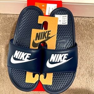 Men’s size 9 Nike Slides, Dark blue with white letters. Brand new with tags.